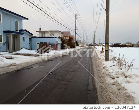 Snow-covered road 136347124