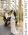 Pregnant woman and man celebrating maternity in romantic nature setting 136347657