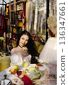 Woman holding green apple in vintage cottagecore setting 136347661