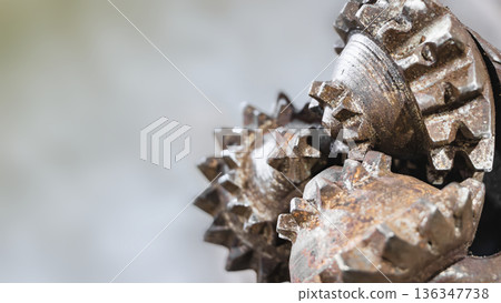 Metal components of a drilling rig are shown as they prepare to extract oil and gas from the ground Metal components of a drilling rig are shown as they prepare to extract oil and gas from the ground 136347738
