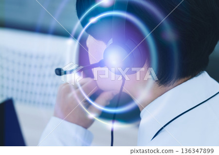 Talking on a headset Talking on a headset 136347899