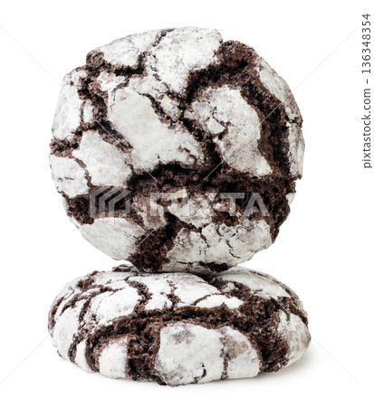 Two homemade chocolate crinkle cookies on a white background. Isolated Two homemade chocolate crinkle cookies on a white background. Isolated 136348354