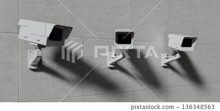 Three security CCTV cameras mounted on wall, security background 136348563