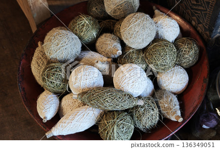 A group of yarns dyed with indigo and natural colors used in handicrafts and weaving. A group of yarns dyed with indigo and natural colors used in handicrafts and weaving. 136349051