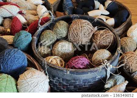 A group of yarns dyed with indigo and natural colors used in handicrafts and weaving. A group of yarns dyed with indigo and natural colors used in handicrafts and weaving. 136349052