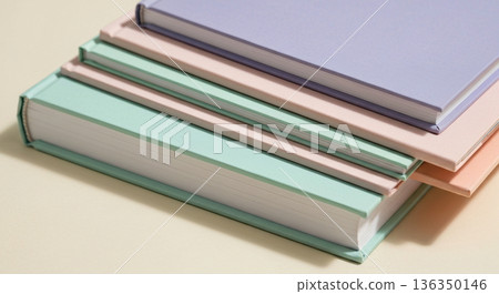 Pastel-colored books piled up haphazardly Pastel-colored books piled up haphazardly 136350146