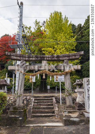 Ikuyama Shrine with its railroad tracks and autumn leaves in Nichinan Town, Hino District, Tottori Prefecture, Japan Ikuyama Shrine with its railroad tracks and autumn leaves in Nichinan Town, Hino District, Tottori Prefecture, Japan 136350887