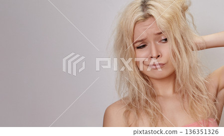 Blonde Caucasian Woman With Frizzy Hair Beauty Blogger Frustrated After Diy Styling Experiment, Tugging Strands, Disappointed Expression, Damaged Texture, Bad Hair Condition, Messy Hair Blonde Caucasian Woman With Frizzy Hair Beauty Blogger Frustrated After Diy Styling Experiment, Tugging Strands, Disappointed Expression, Damaged Texture, Bad Hair Condition, Messy Hair 136351326