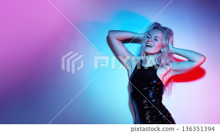 Blonde Model Posing In Neon Lit Studio, Sequin Dress, Hands Behind Head, Eyes Closed, Colorful Pink And Blue Gel Lighting, Joyful Expression, Nightclub Energy, Editorial Glamour, Glossy Texture Blonde Model Posing In Neon Lit Studio, Sequin Dress, Hands Behind Head, Eyes Closed, Colorful Pink And Blue Gel Lighting, Joyful Expression, Nightclub Energy, Editorial Glamour, Glossy Texture 136351394