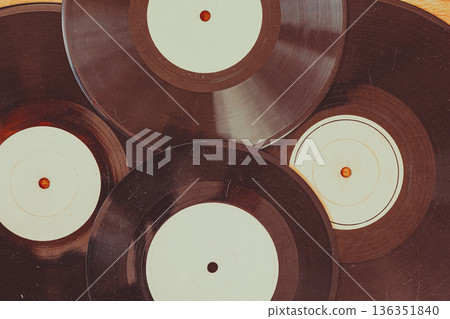 Vintage vinyl records flat lay with circular shapes and worn surfaces, music background for design, mockup, cover layout. Vinyl representing analog sound, music culture, nostalgia, copy space backdrop 136351840