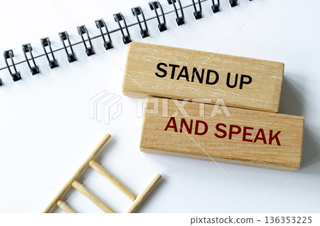STAND UP AND SPEAK text on wooden blocks symbolizing moral courage and organizational integrity. STAND UP AND SPEAK text on wooden blocks symbolizing moral courage and organizational integrity. 136353225
