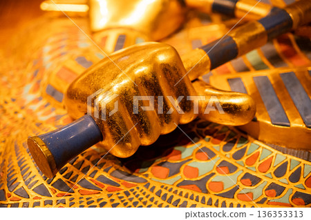 Hand of Tutankhamun Holding Royal Crook and Flail.Ancient Egyptian power symbols Hand of Tutankhamun Holding Royal Crook and Flail.Ancient Egyptian power symbols 136353313