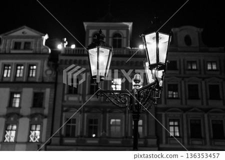 Old street lanterns glowing at night in historic Prague city center Old street lanterns glowing at night in historic Prague city center 136353457