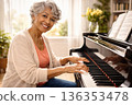 Old lady playing the piano 136353478