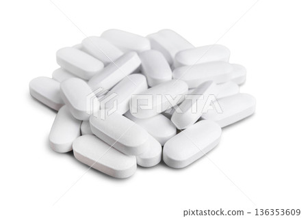 Pile of white tablets, medicine pill capsules, supplement, vitamin isolated on white background Pile of white tablets, medicine pill capsules, supplement, vitamin isolated on white background 136353609