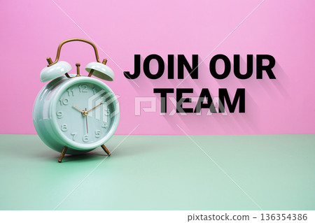 Black alarm clock on a pastel green and pink background with the text "Join Our Team" Black alarm clock on a pastel green and pink background with the text "Join Our Team" 136354386