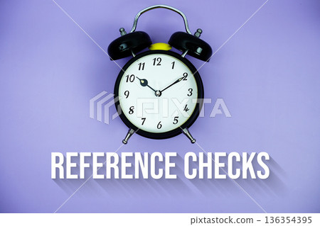 Reference Checks text and alarm clock on purple background Reference Checks text and alarm clock on purple background 136354395