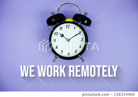 We Work Remotely text and alarm clock on purple background 136354400