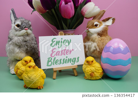 Enjoy Easter Blessings text with easter elements decoration on pink and green background Enjoy Easter Blessings text with easter elements decoration on pink and green background 136354417