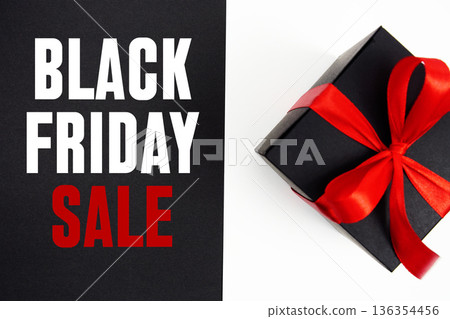 Black Friday Sale text with gift box present on black and white background Black Friday Sale text with gift box present on black and white background 136354456