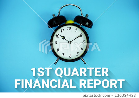 First Quarter Results text and alarm clock on blue background First Quarter Results text and alarm clock on blue background 136354458