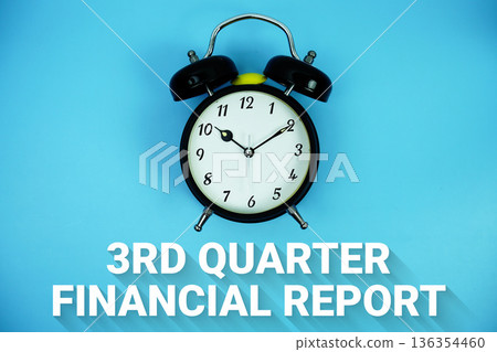 Third Quarter Results text and alarm clock on blue background 136354460