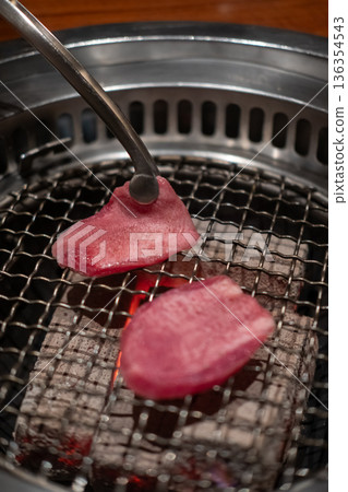 Japanese style sliced rare beef tongue meat on charcoal grill Japanese style sliced rare beef tongue meat on charcoal grill 136354543