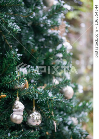 Close-up of Christmas tree decoration ornament, with fake snow soap bubbles, with blur bokeh background. Close-up of Christmas tree decoration ornament, with fake snow soap bubbles, with blur bokeh background. 136354544
