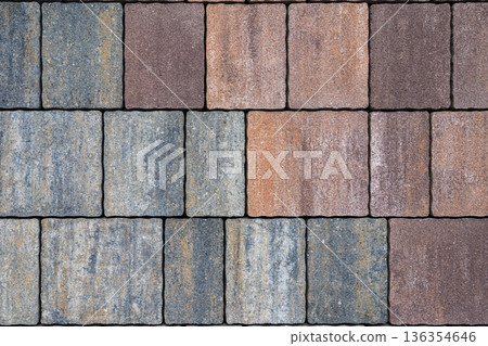 Paving stone surface with square blocks, straight grid pattern, durable paving material for sidewalk, walkway, landscape project, urban construction ground cover. Natural background of stone texture Paving stone surface with square blocks, straight grid pattern, durable paving material for sidewalk, walkway, landscape project, urban construction ground cover. Natural background of stone texture 136354646