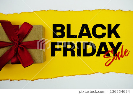 Black Friday Sale text with gift box present on yellow background Black Friday Sale text with gift box present on yellow background 136354654