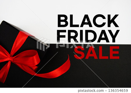 Black Friday Sale text with gift box present on black and white background Black Friday Sale text with gift box present on black and white background 136354659
