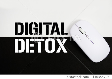 Digital Detox text and wireless mouse on white and black background Digital Detox text and wireless mouse on white and black background 136354706