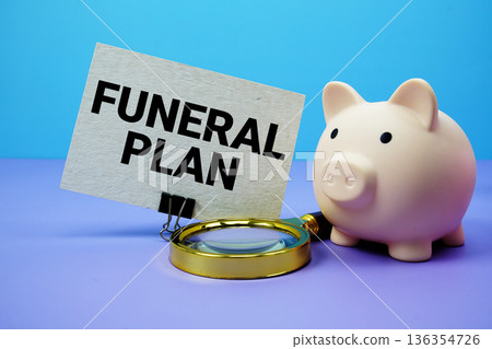 Funeral Plan text with piggy bank and magnifying glass on blue and purple background Funeral Plan text with piggy bank and magnifying glass on blue and purple background 136354726