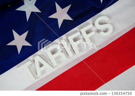 Tariffs alphabet letters with usa flag on wooden background Tariffs alphabet letters with usa flag on wooden background 136354750