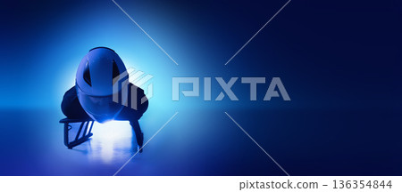 Digital artwork of skeleton athlete in head-first position on blue ice background. 136354844