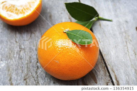 Oranges healthy fruit is placed on wooden floor. Oranges healthy fruit is placed on wooden floor. 136354915