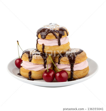 Delicious french cream puffs profiteroles topped with chocolate drizzle and fresh cherries, isolated. Perfect for bakery treats and desserts 136355041