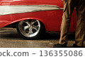 American cars and the feet of people watching 136355086