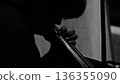 A person who plays a wood bass 136355090