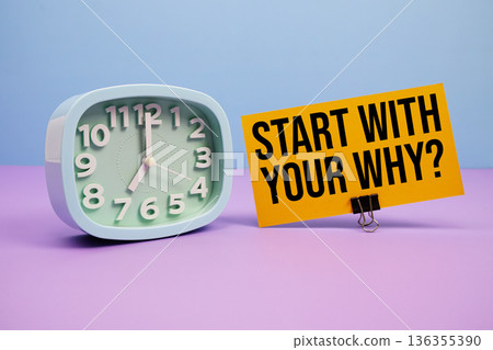 Start With Your Why? text and alarm clock on blue and purple background 136355390