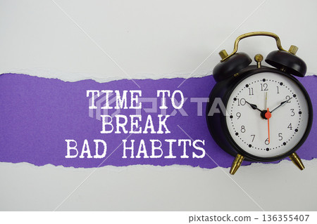 Time To Break Bad Habits text on purple with white paper torn ripped of horizontal and alarm clock Time To Break Bad Habits text on purple with white paper torn ripped of horizontal and alarm clock 136355407