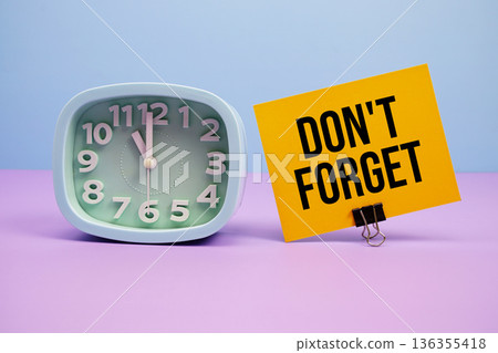 Don't Forget text and alarm clock on blue and purple background 136355418