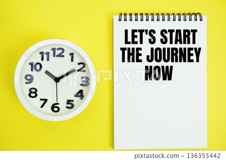 Let's Start The Journey Now text with alarm clock flat lay on yellow background 136355442