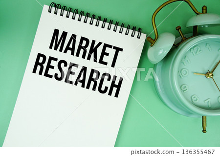 Market Research text with alarm clock flat lay on green background 136355467