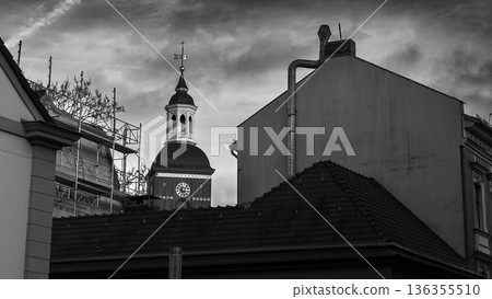 Historic Clock Tower Between Old City Buildings in Black and White Historic Clock Tower Between Old City Buildings in Black and White 136355510