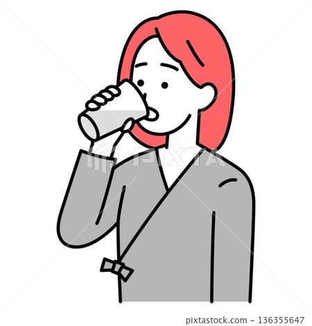 身穿檢查服的年輕女子正在服用鋇劑 身穿檢查服的年輕女子正在服用鋇劑 136355647