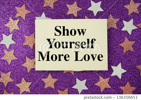 "show yourself more love" quotes on paper card with purple glitter background with pink and white stars "show yourself more love" quotes on paper card with purple glitter background with pink and white stars 136356651