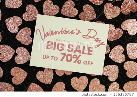 Valentine's Day Big Sale 70% off with pink heart on black glitter background 136356797