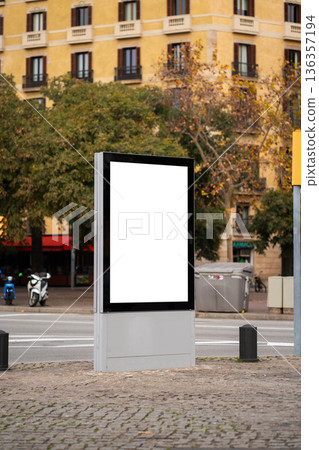 Blank billboard advertising display mockup standing on city street sidewalk, finding space for copy and urban branding in a modern public information panel Blank billboard advertising display mockup standing on city street sidewalk, finding space for copy and urban branding in a modern public information panel 136357194