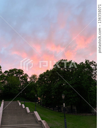 pink sky at sunset in the park above the high stairs 136358071